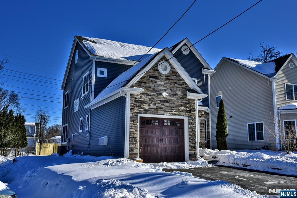 130 Reich Avenue Mahwah, NJ 07430 - Photo 2 of 30 a front view of a house with a yard