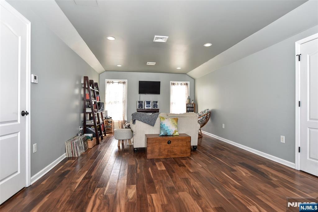 130 Reich Avenue Mahwah, NJ 07430 - Photo 23 of 30 a living room with furniture and wooden floor