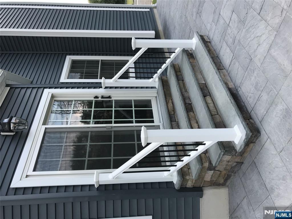 130 Reich Avenue Mahwah, NJ 07430 - Photo 28 of 30 a view of a house with a large window and stairs