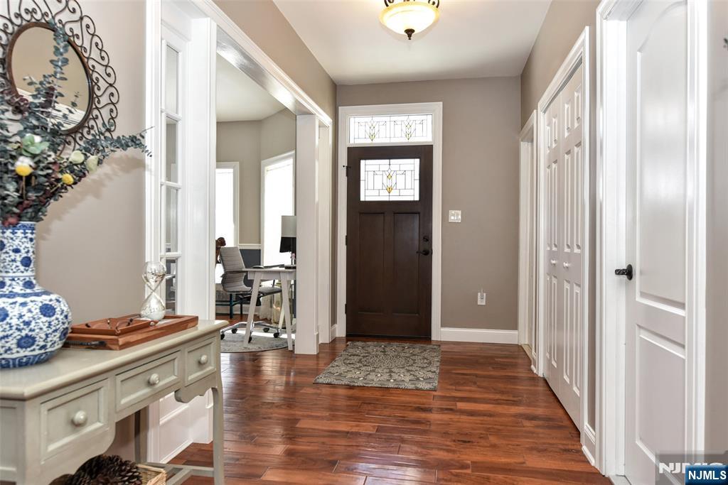 130 Reich Avenue Mahwah, NJ 07430 - Photo 4 of 30 a view of a hallway view with wooden floor and dining room