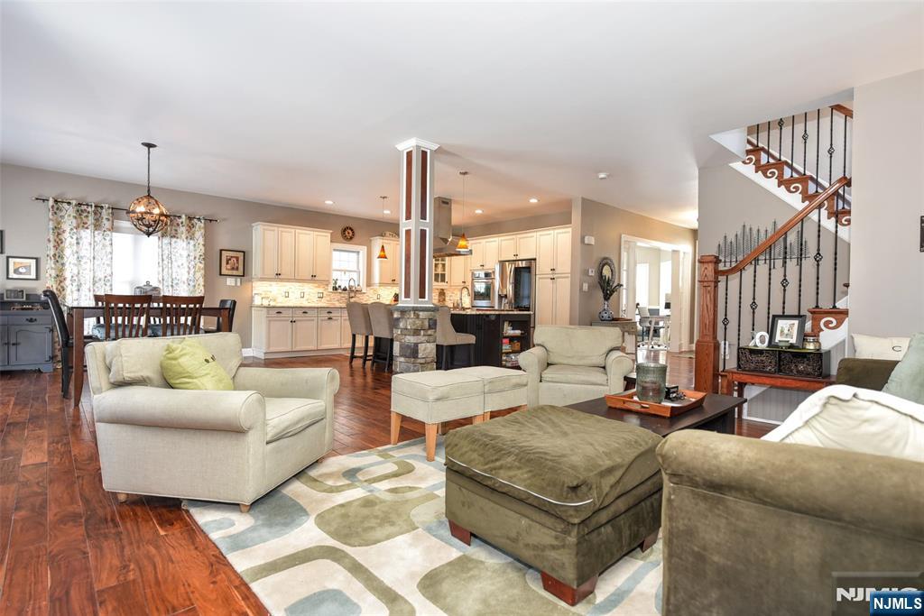 130 Reich Avenue Mahwah, NJ 07430 - Photo 7 of 30 a living room with furniture wooden floor and kitchen view