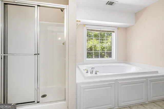 a bathroom with a sink and a shower