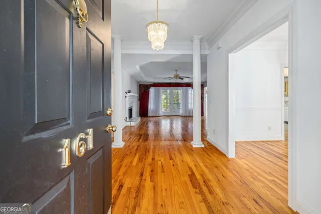 a view of a living room with wooden floor