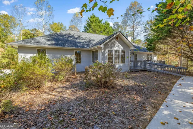 a house that has a tree in front of it
