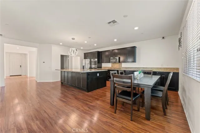 a view of kitchen with cabinets and wooden floor