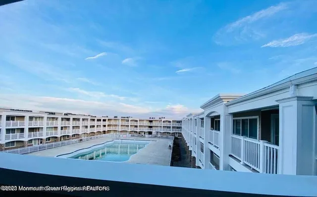 a view of a balcony with furniture