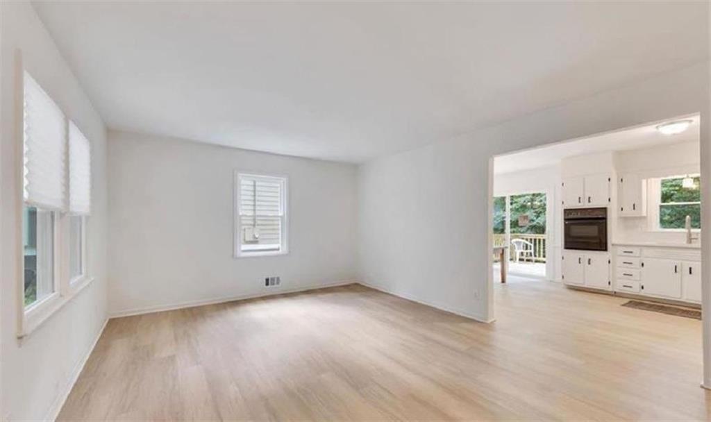 4520 Santa Fe Trail Southwest Atlanta, GA 30331 - Photo 4 of 19 an empty room with furniture and wooden floor