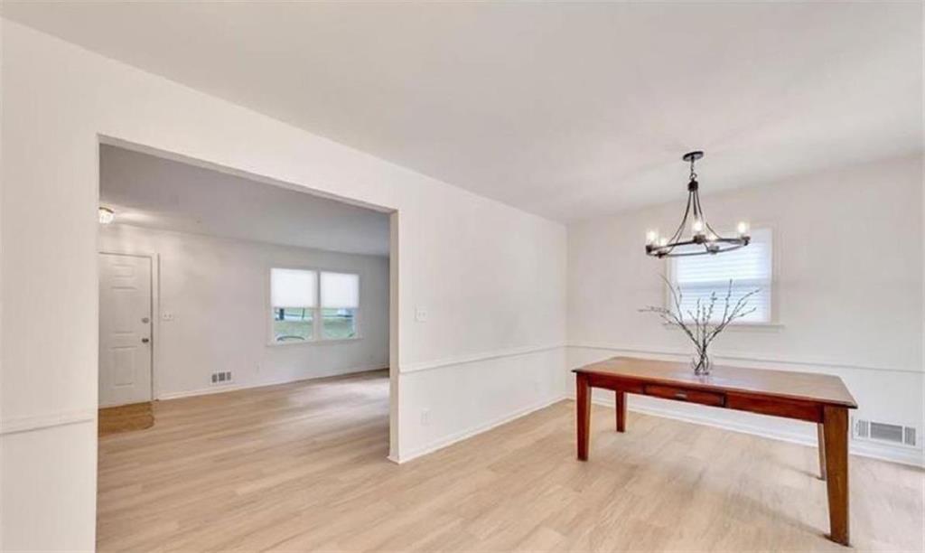 4520 Santa Fe Trail Southwest Atlanta, GA 30331 - Photo 7 of 19 a view of a room with wooden floor and cabinet