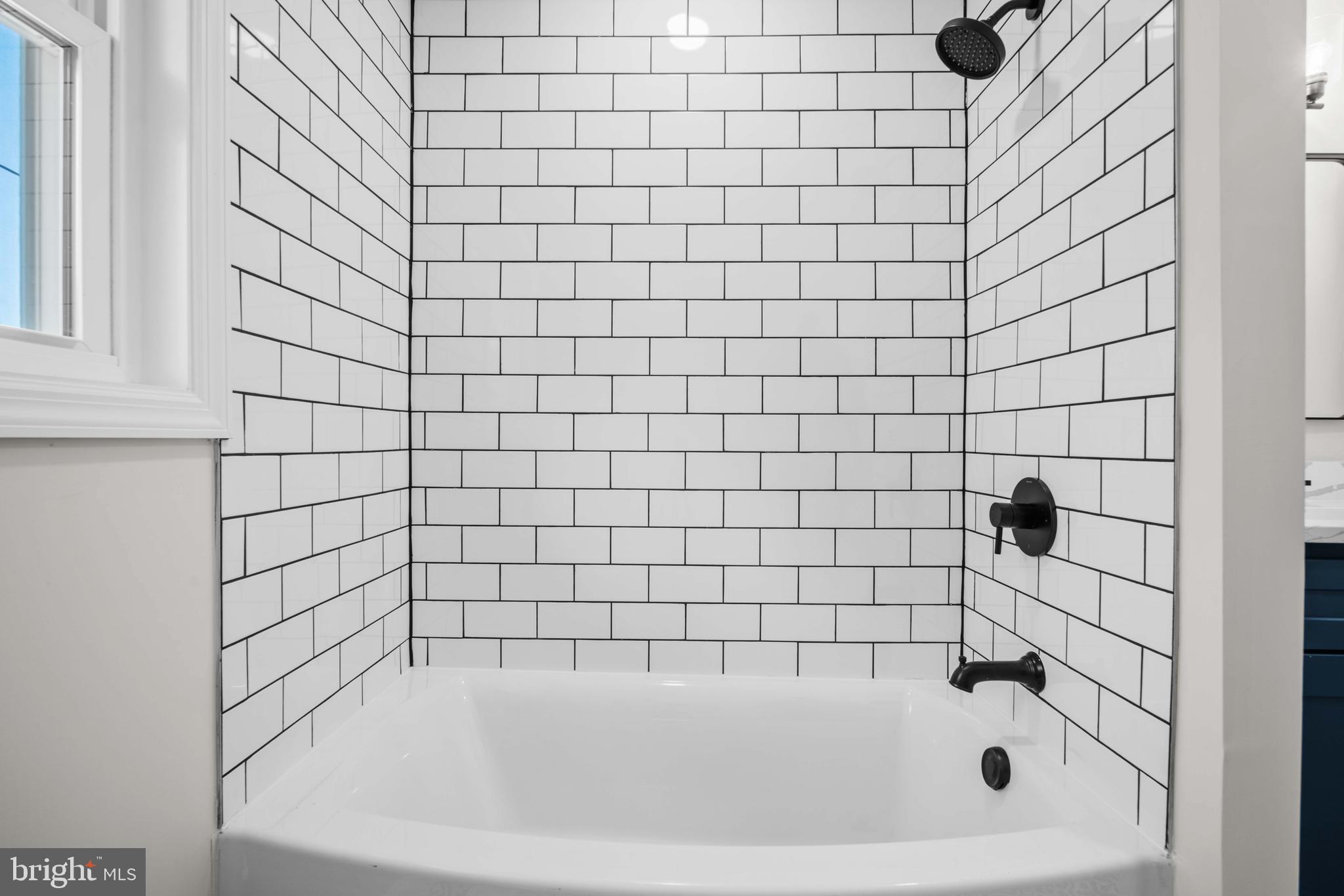 15388 Point Lookout Road St. Inigoes, MD 20684 - Photo 13 of 29 a bathroom with a bathtub