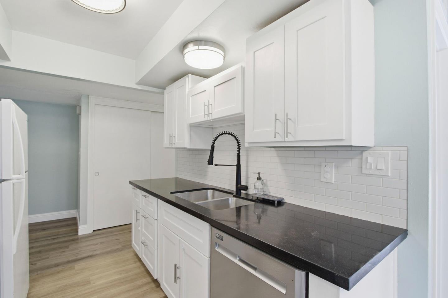 2100 Tiny Street Milpitas, CA 95035 - Photo 13 of 41 a kitchen with a sink and cabinets