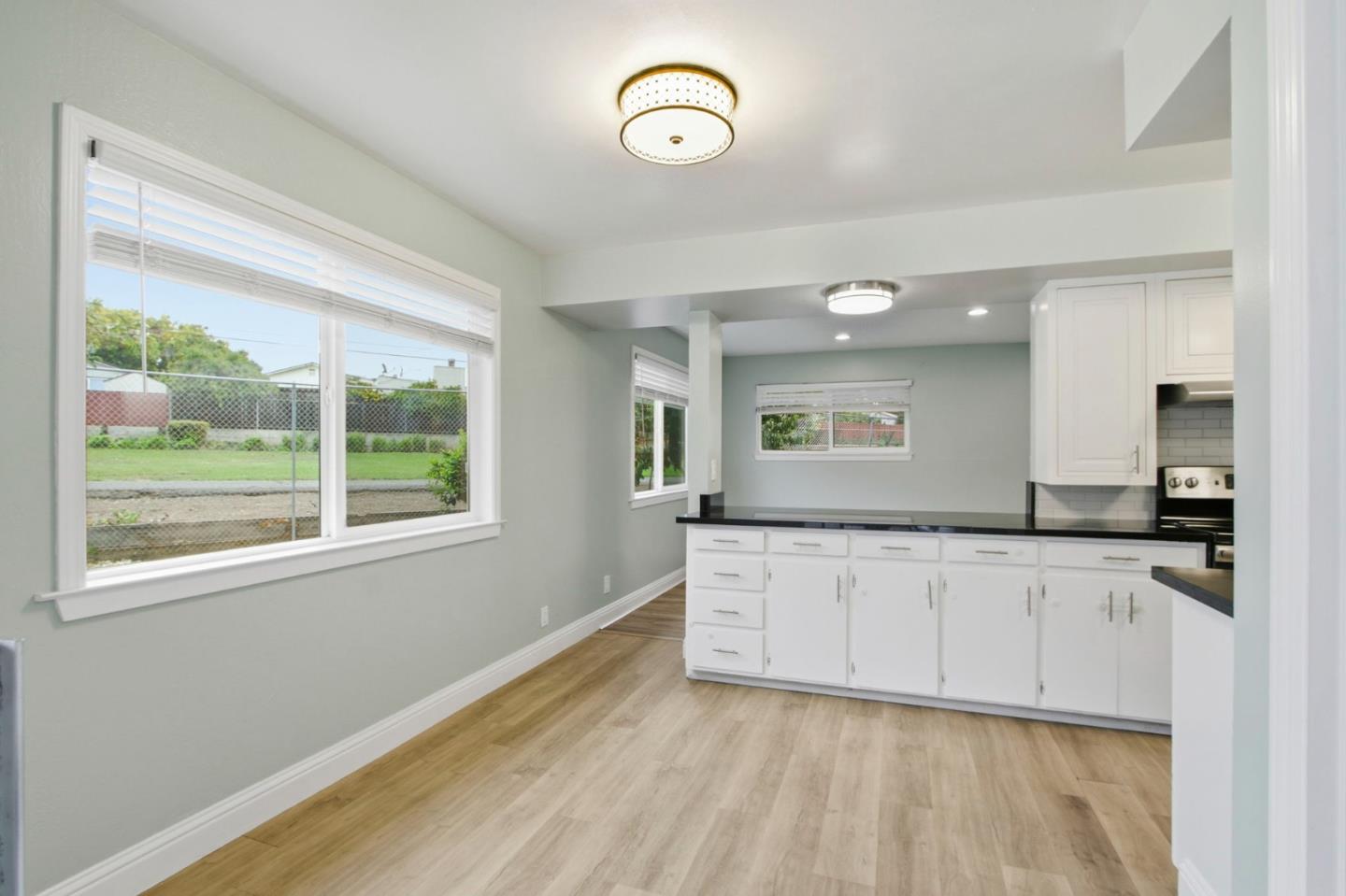 2100 Tiny Street Milpitas, CA 95035 - Photo 15 of 41 a view of a kitchen with wooden floor and window