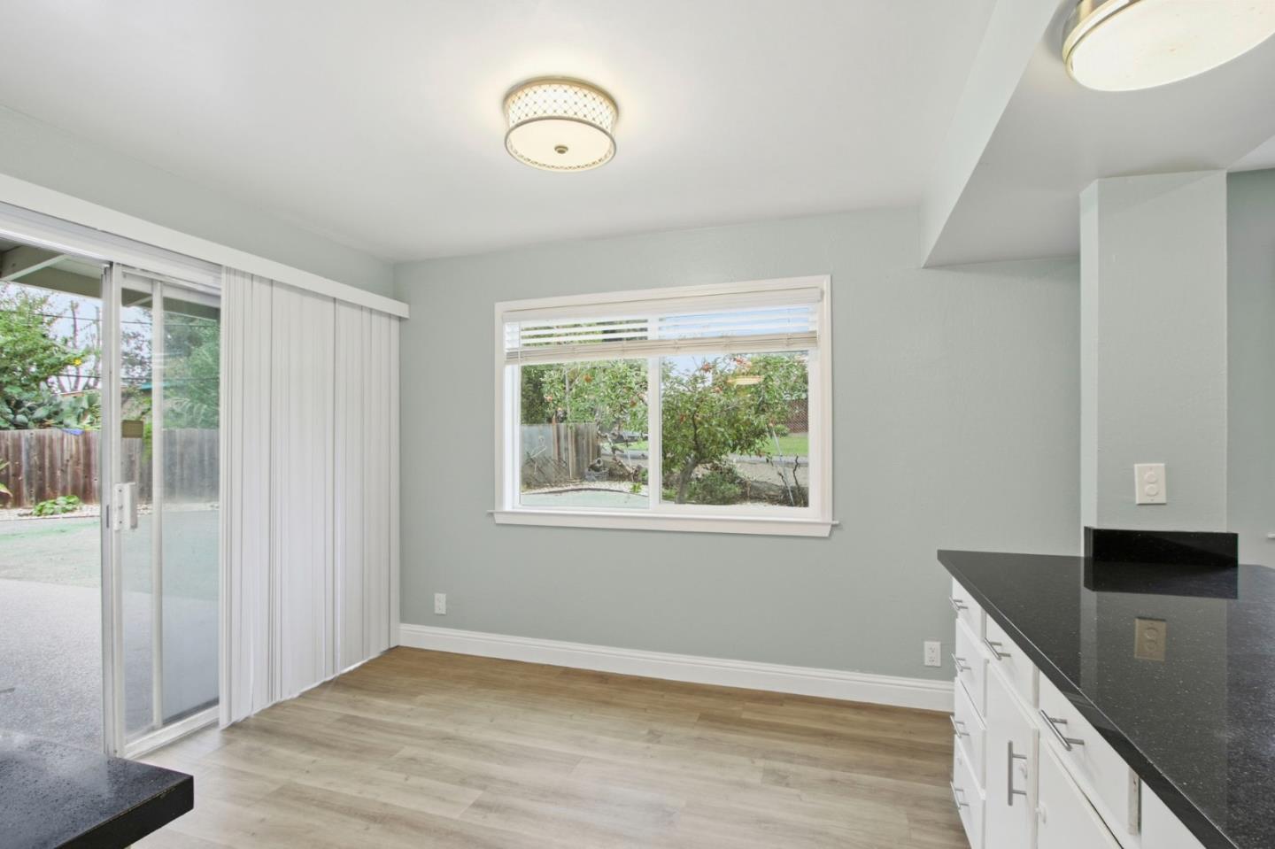 2100 Tiny Street Milpitas, CA 95035 - Photo 16 of 41 a view of a kitchen with wooden floor and a window