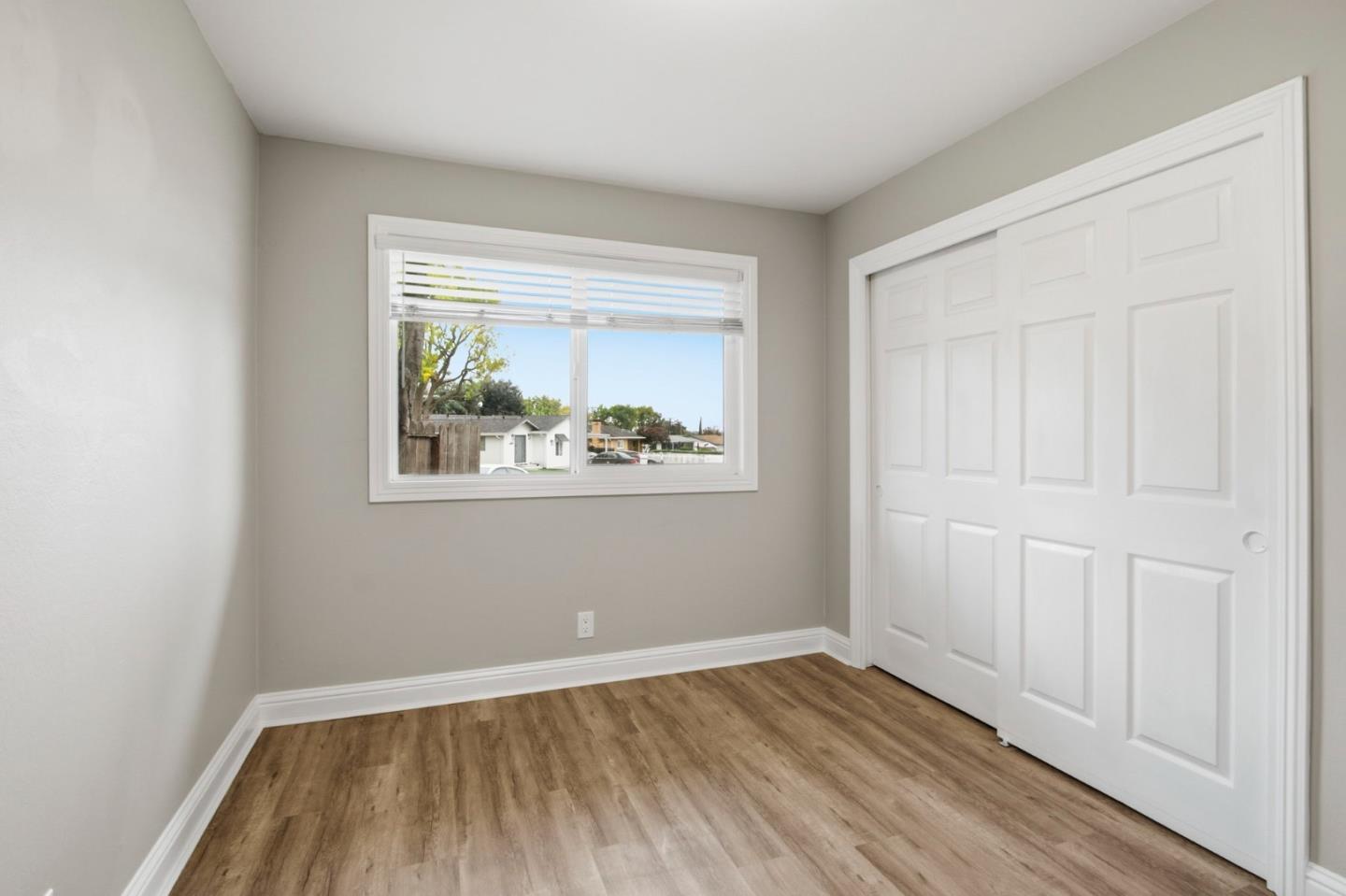 2100 Tiny Street Milpitas, CA 95035 - Photo 20 of 41 a view of an empty room with wooden floor and a window