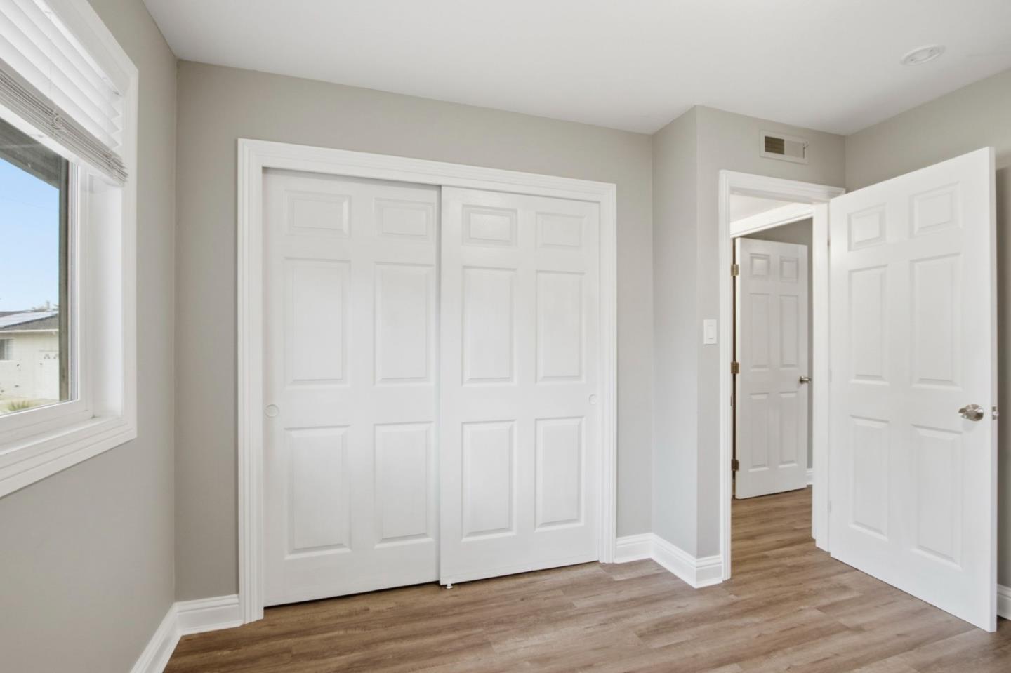 2100 Tiny Street Milpitas, CA 95035 - Photo 22 of 41 an empty room with wooden floor and closet area