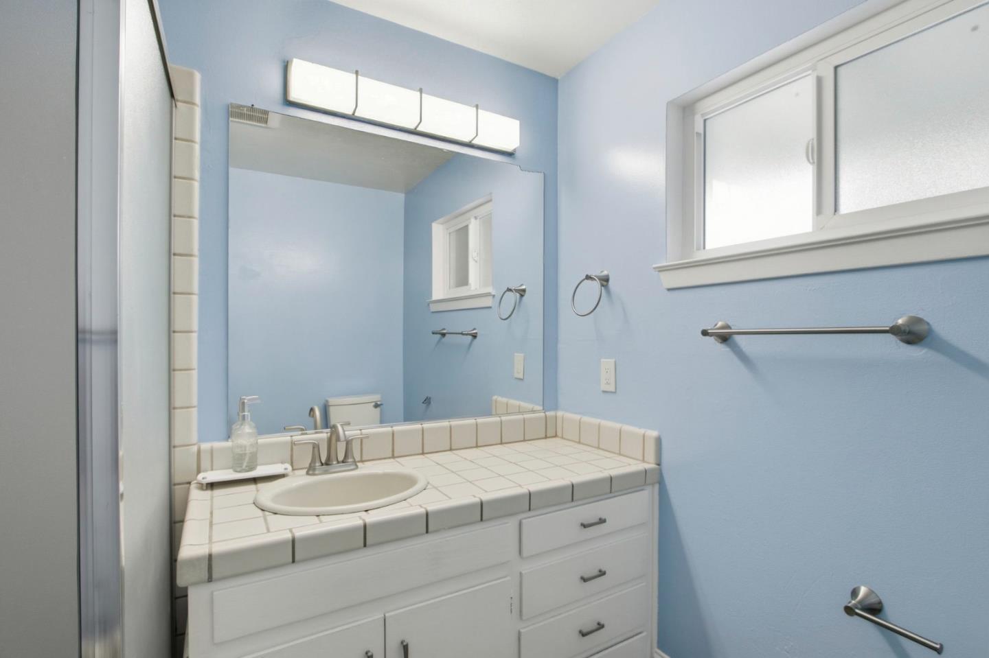 2100 Tiny Street Milpitas, CA 95035 - Photo 24 of 41 a bathroom with a sink and a mirror