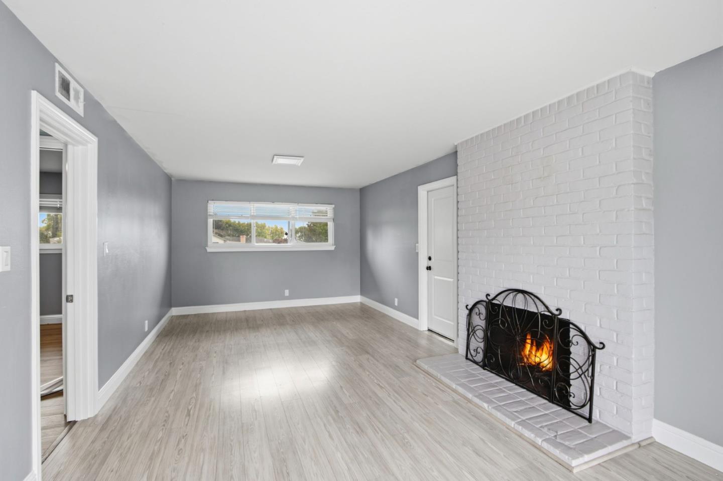 2100 Tiny Street Milpitas, CA 95035 - Photo 27 of 41 an empty room with wooden floor and windows