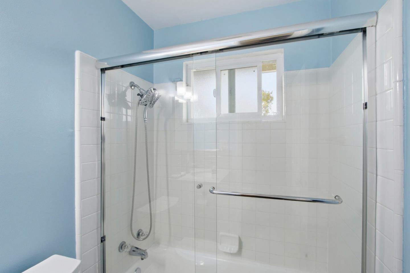 2100 Tiny Street Milpitas, CA 95035 - Photo 30 of 41 a bathroom with a glass shower door