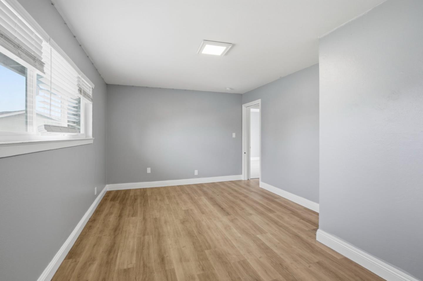 2100 Tiny Street Milpitas, CA 95035 - Photo 32 of 41 an empty room with wooden floor and windows