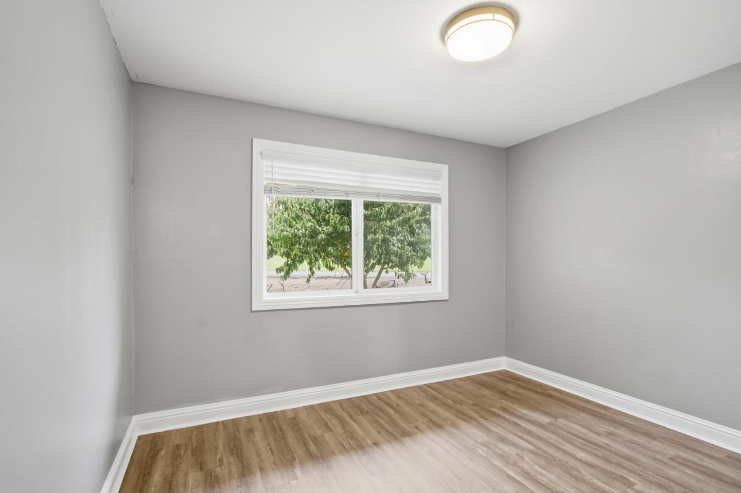 2100 Tiny Street Milpitas, CA 95035 - Photo 9 of 41 an empty room with wooden floor and windows