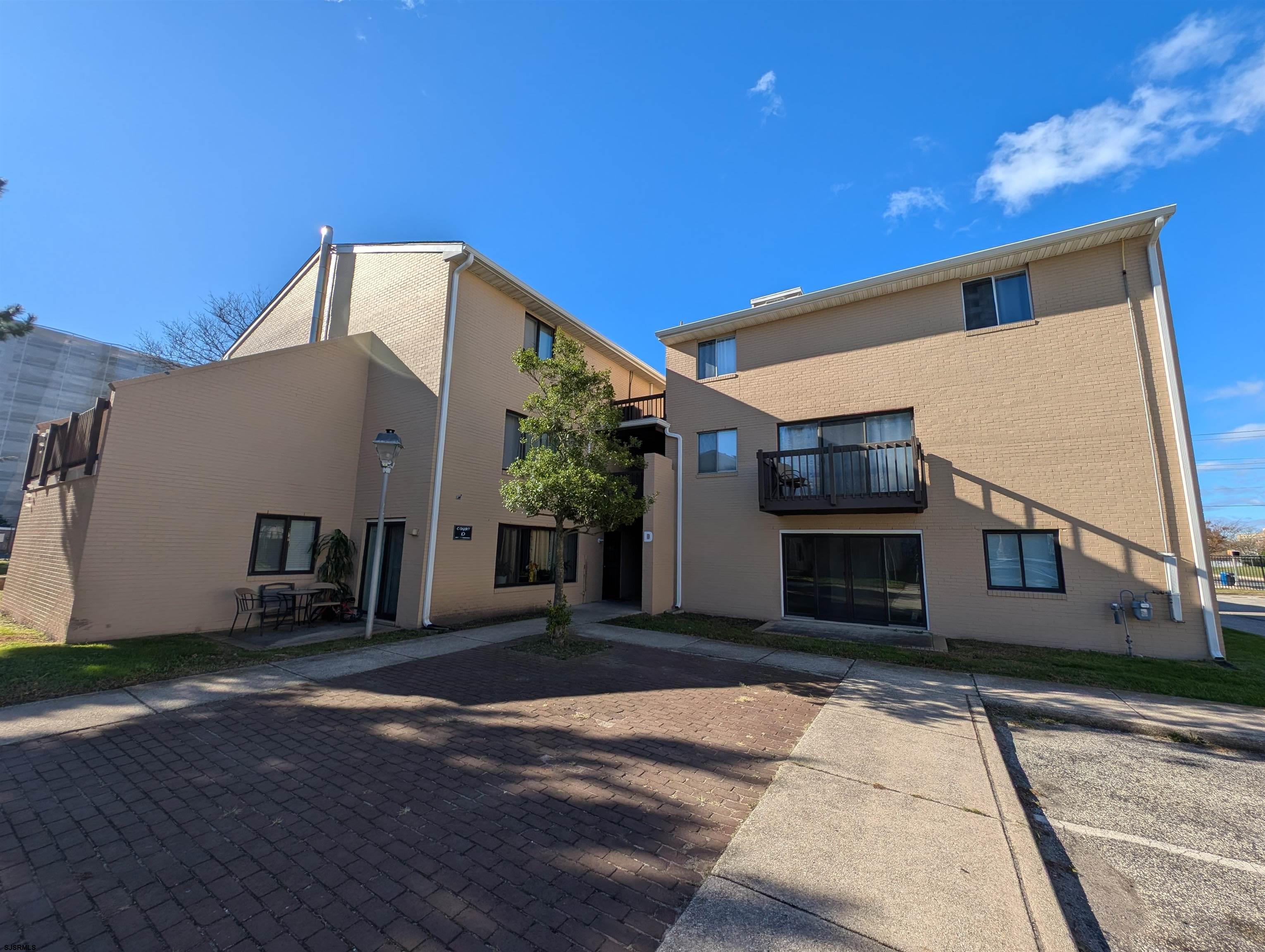 600 Pacific Avenue, Unit D102 Atlantic City, NJ 08401 - Photo 1 of 35 a view of a house with a street