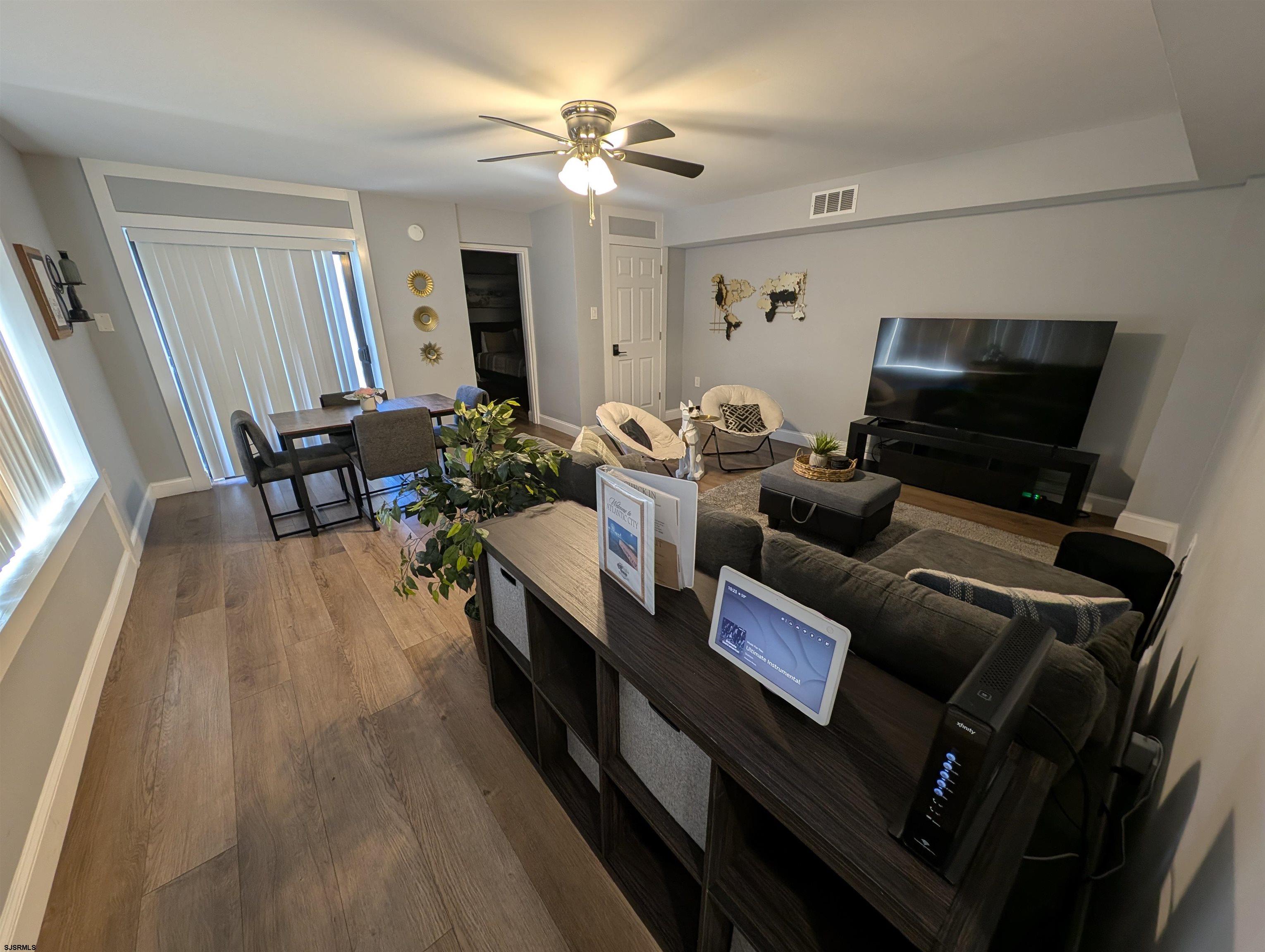 600 Pacific Avenue, Unit D102 Atlantic City, NJ 08401 - Photo 11 of 35 a living room with furniture and a flat screen tv