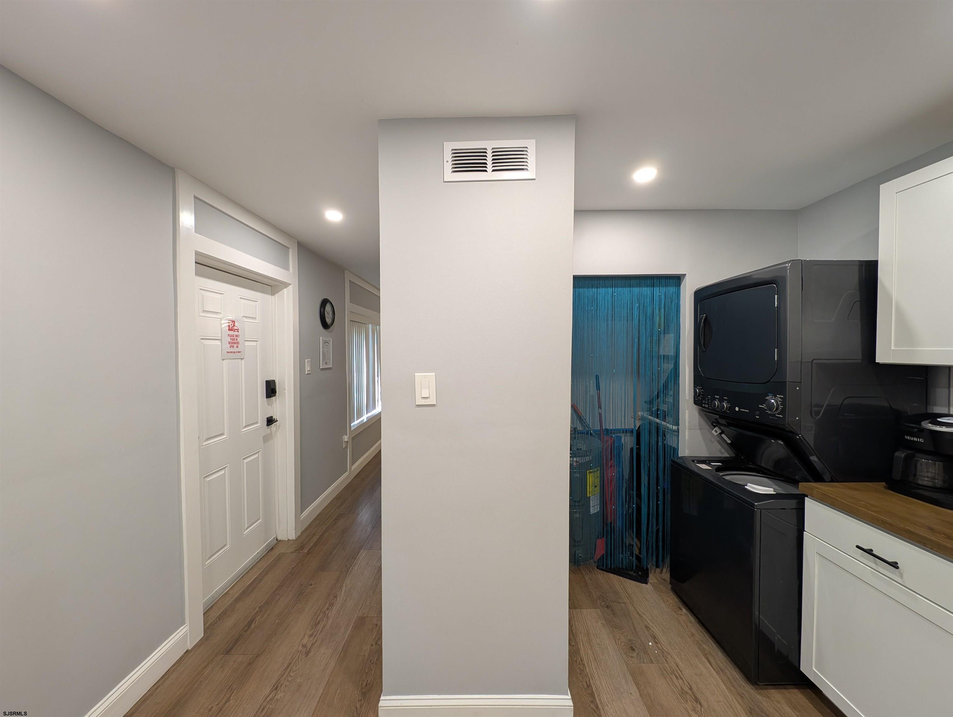600 Pacific Avenue, Unit D102 Atlantic City, NJ 08401 - Photo 18 of 35 a kitchen with a refrigerator and a sink