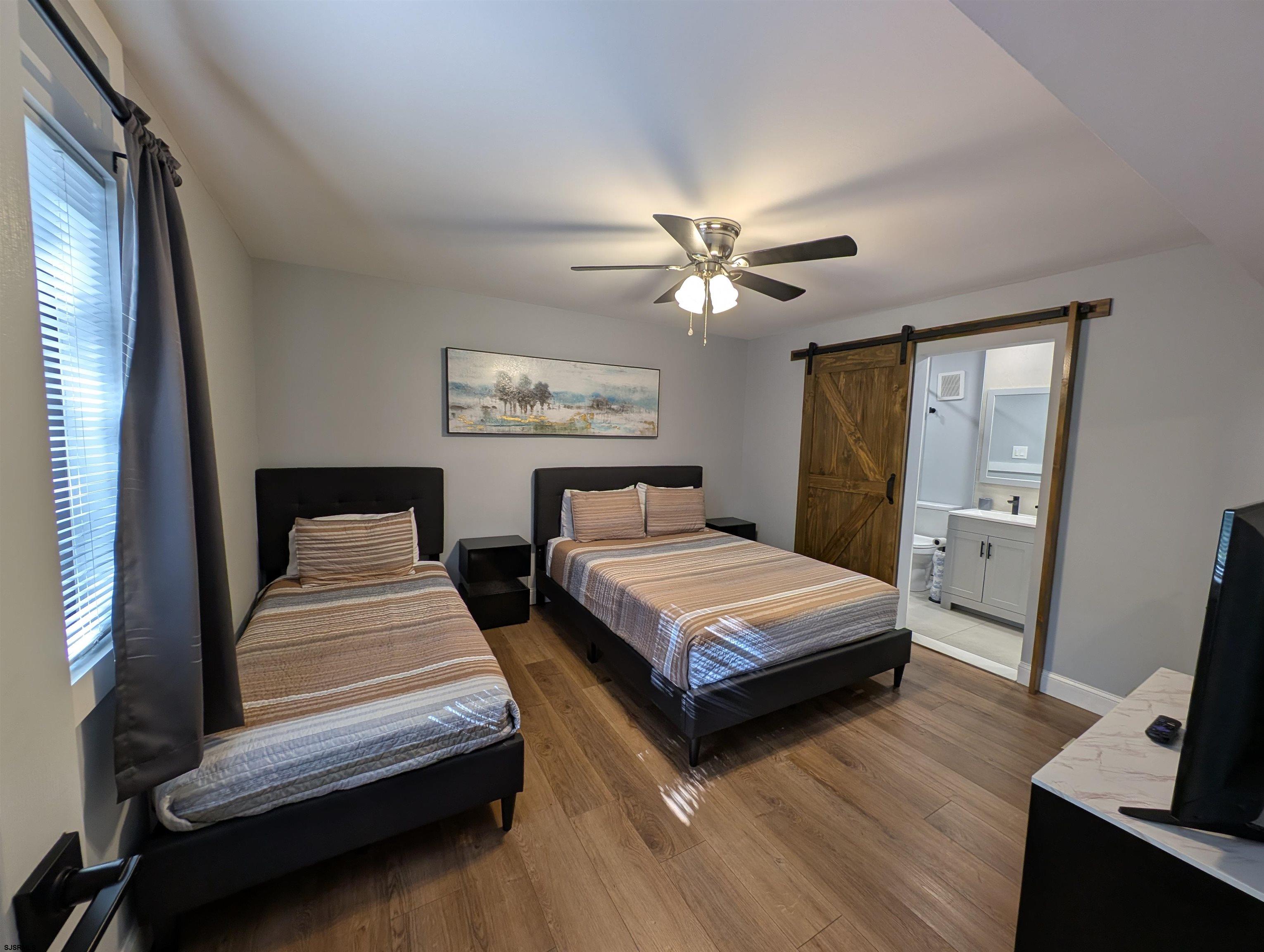 600 Pacific Avenue, Unit D102 Atlantic City, NJ 08401 - Photo 21 of 35 a bedroom with double bed and a window