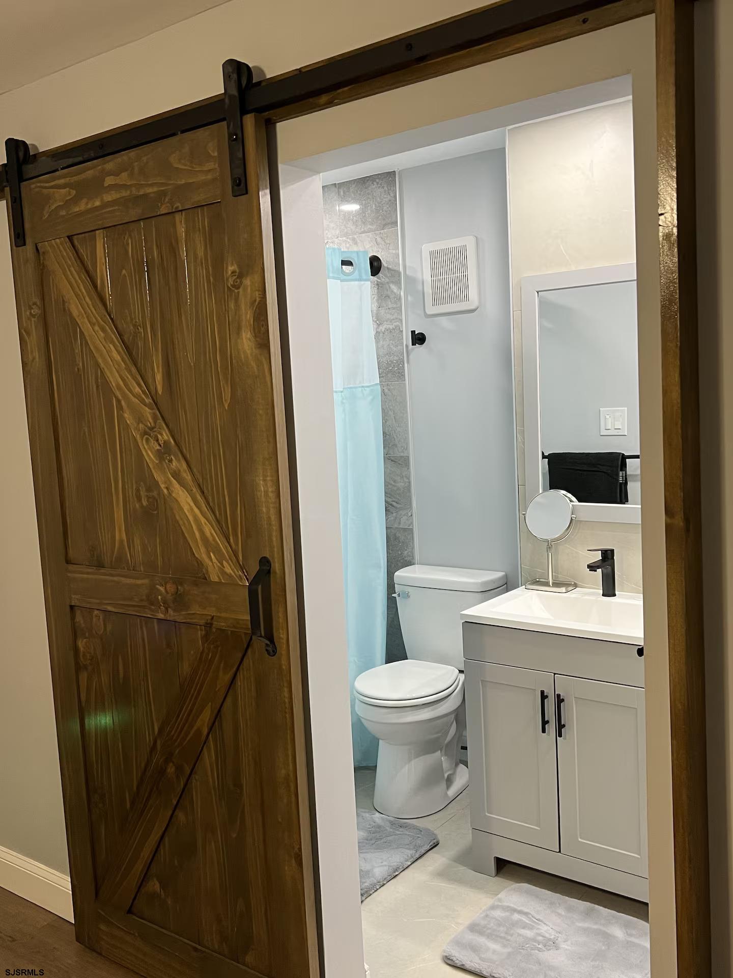 600 Pacific Avenue, Unit D102 Atlantic City, NJ 08401 - Photo 24 of 35 a bathroom with a sink a toilet and shower