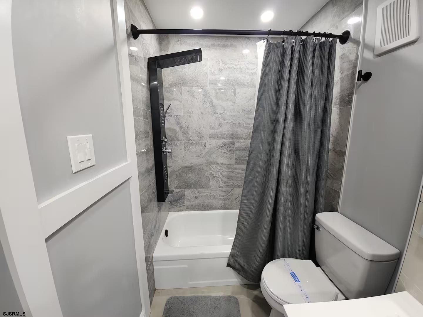 600 Pacific Avenue, Unit D102 Atlantic City, NJ 08401 - Photo 26 of 35 a bathroom with a shower a toilet and a shower