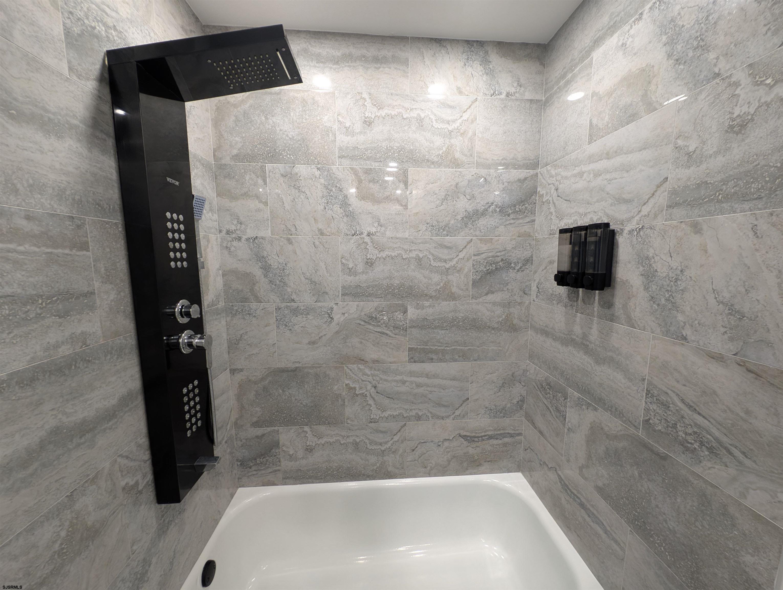 600 Pacific Avenue, Unit D102 Atlantic City, NJ 08401 - Photo 30 of 35 a bathroom with a bathtub