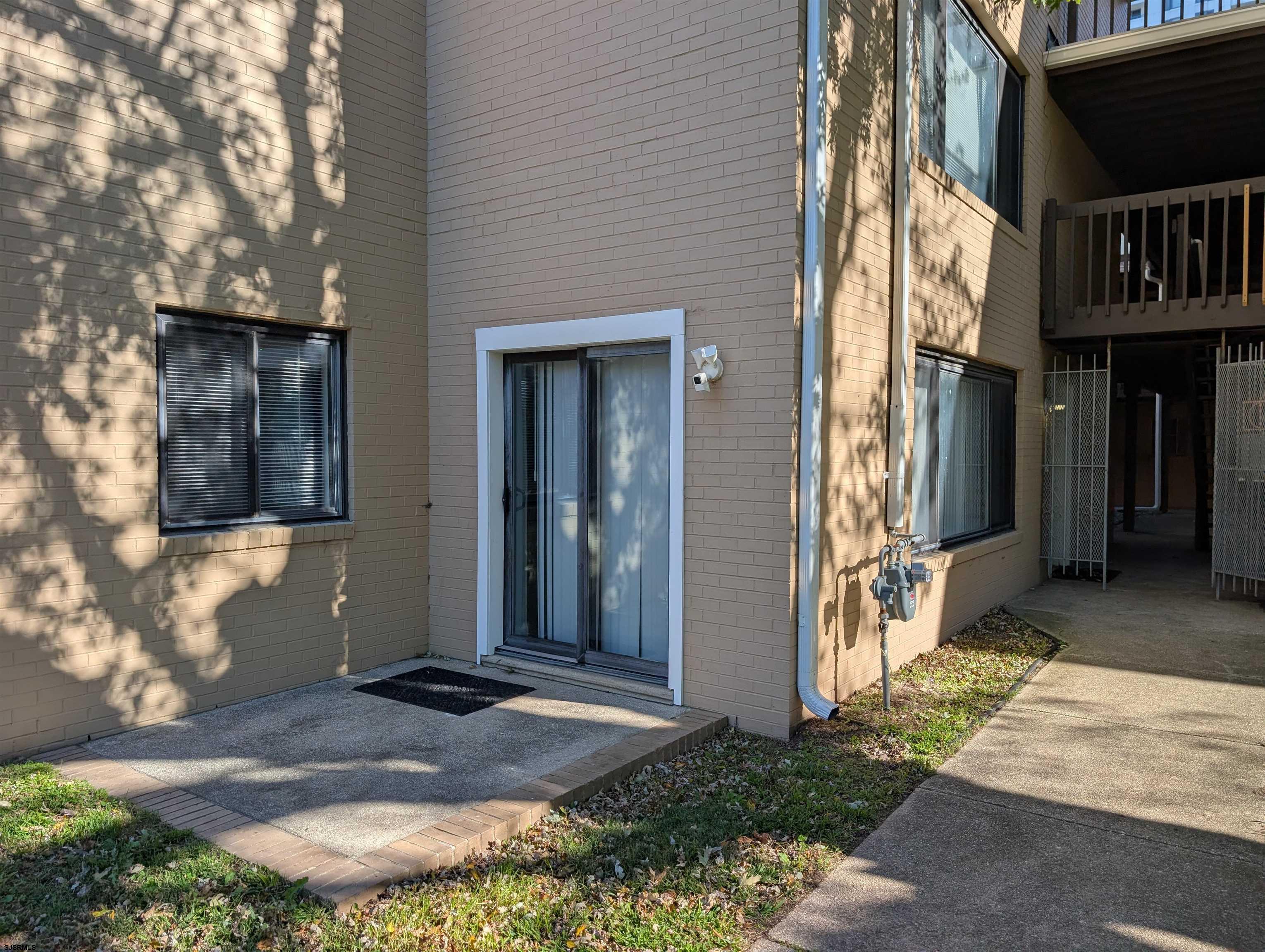 600 Pacific Avenue, Unit D102 Atlantic City, NJ 08401 - Photo 31 of 35 a front view of a house with a yard