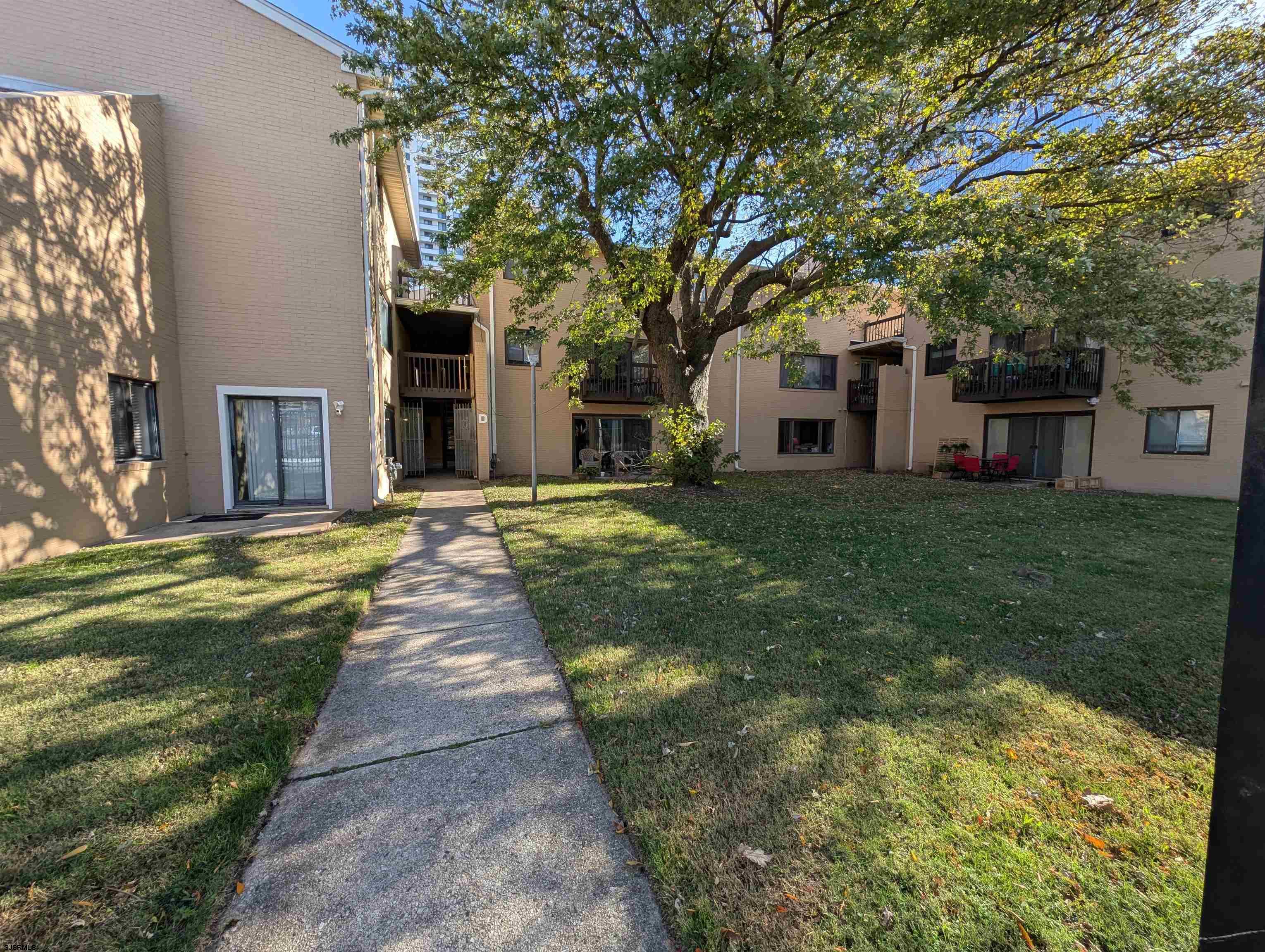 600 Pacific Avenue, Unit D102 Atlantic City, NJ 08401 - Photo 34 of 35 a front view of a house with a garden