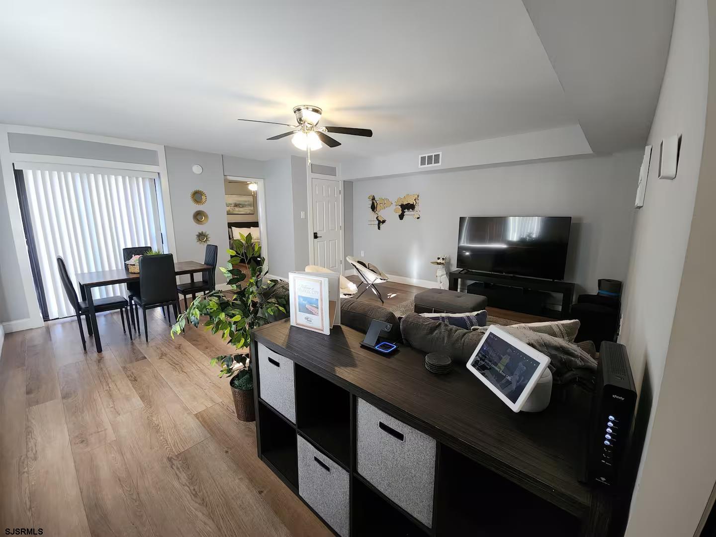 600 Pacific Avenue, Unit D102 Atlantic City, NJ 08401 - Photo 8 of 35 a view of a workspace with furniture and wooden floor