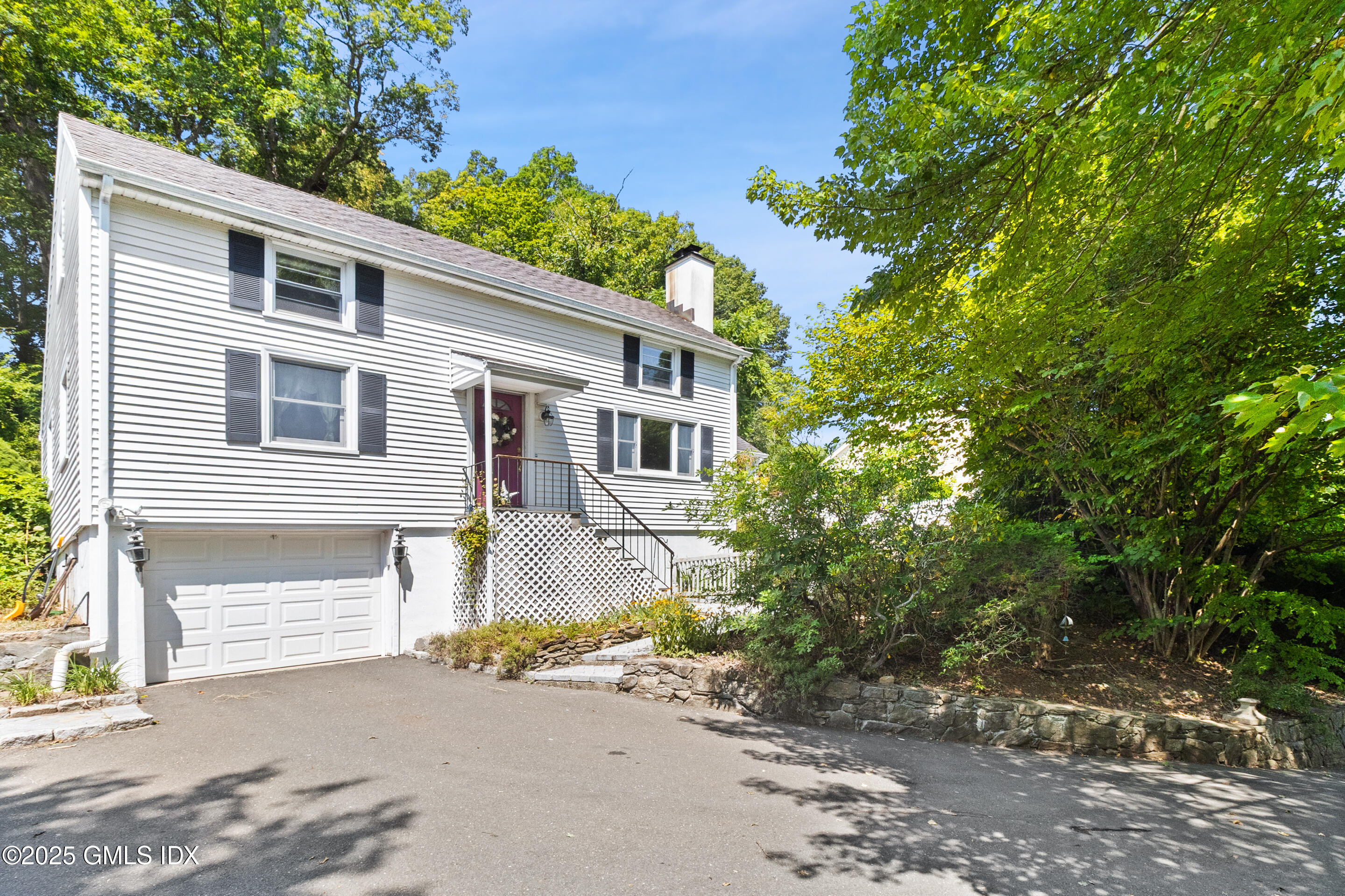 17 Cornwall Road Norwalk, CT 06850 - Photo 1 of 28 a front view of a house with a garden