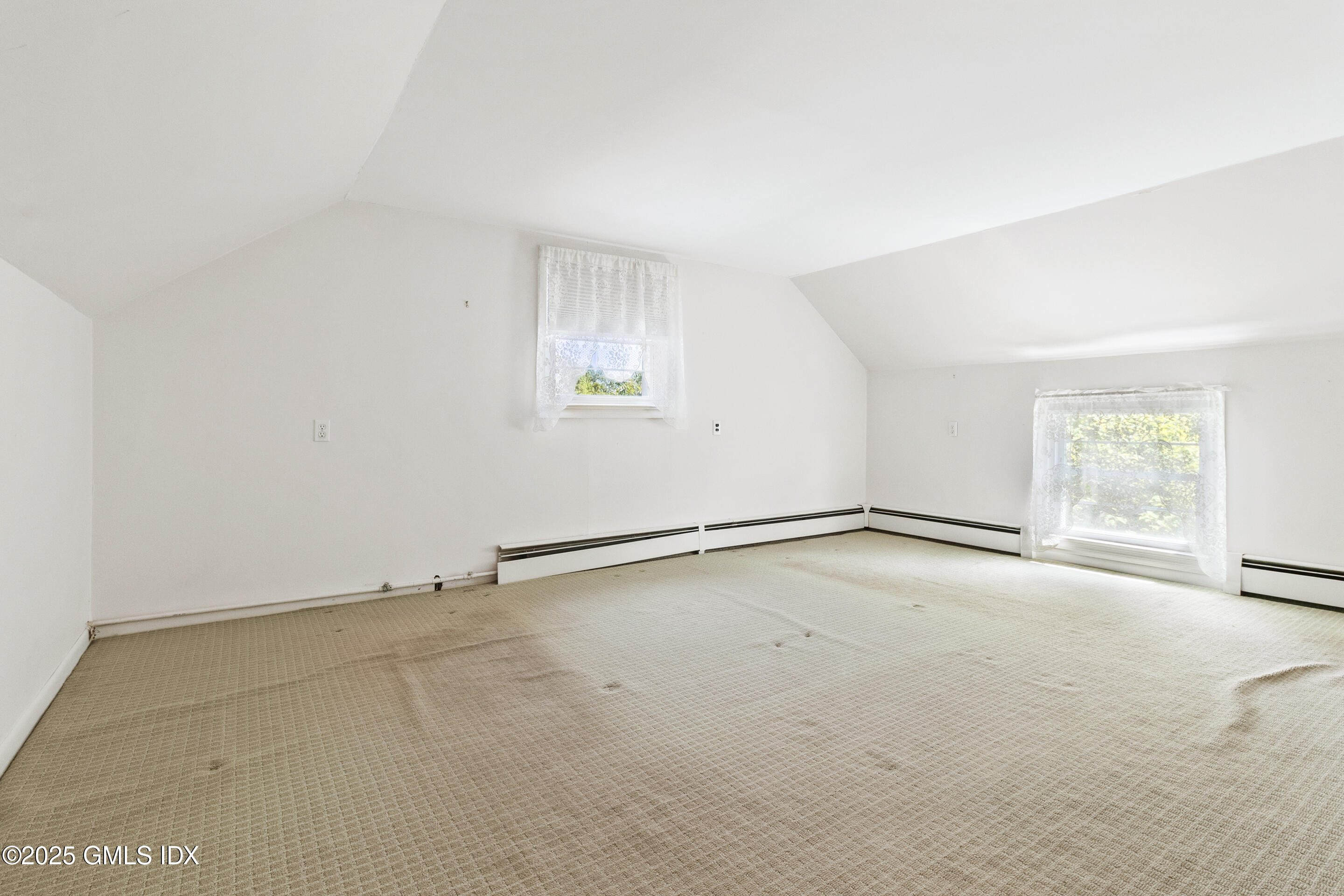 17 Cornwall Road Norwalk, CT 06850 - Photo 20 of 28 an empty room with a empty space and a window