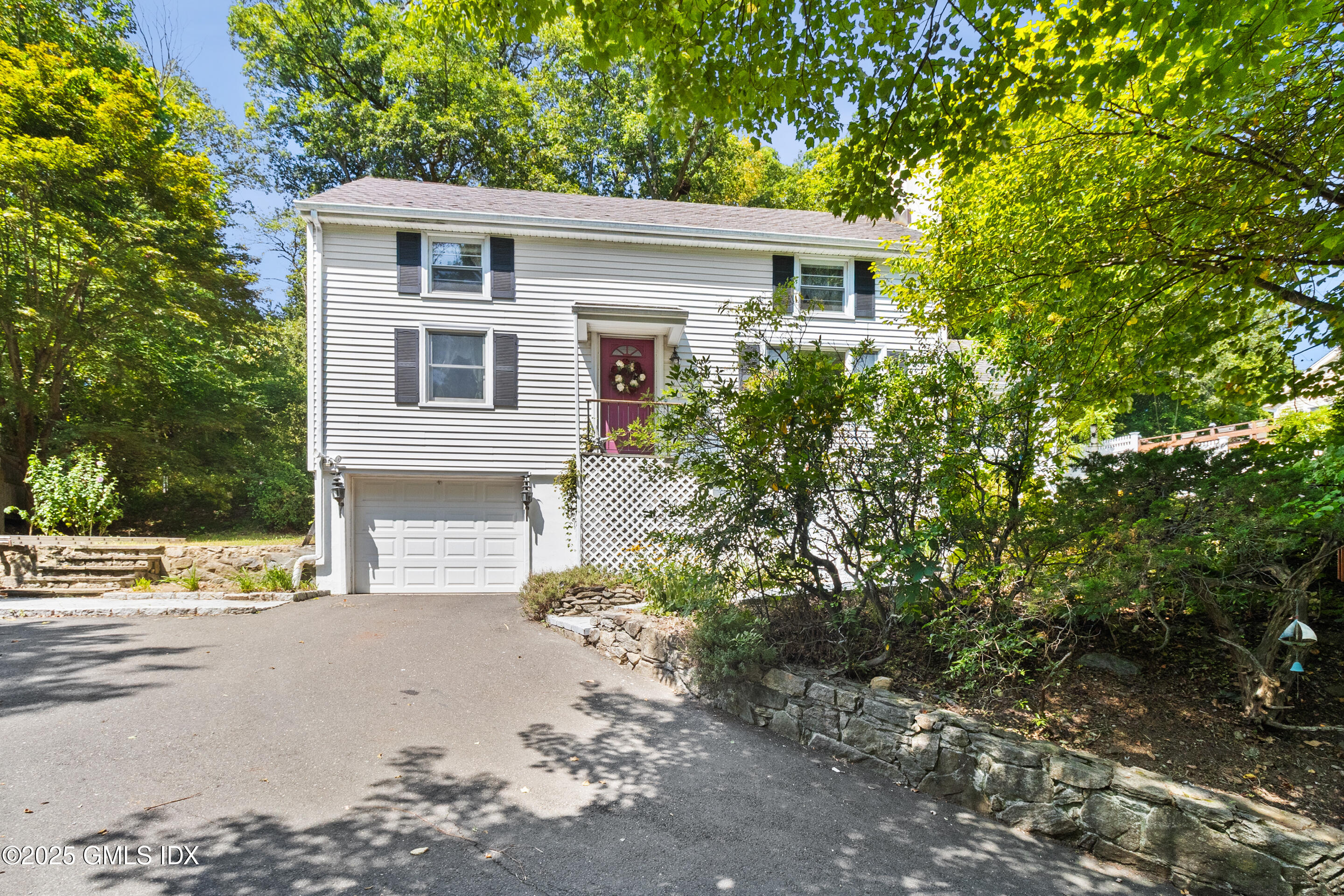 17 Cornwall Road Norwalk, CT 06850 - Photo 2 of 28 front view of a house with a yard