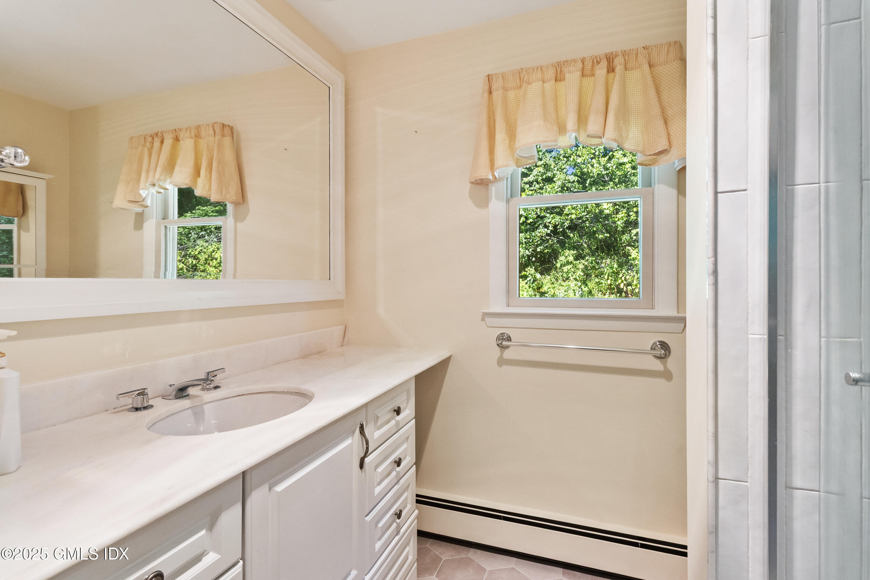 17 Cornwall Road Norwalk, CT 06850 - Photo 24 of 28 a bathroom with a sink and a window