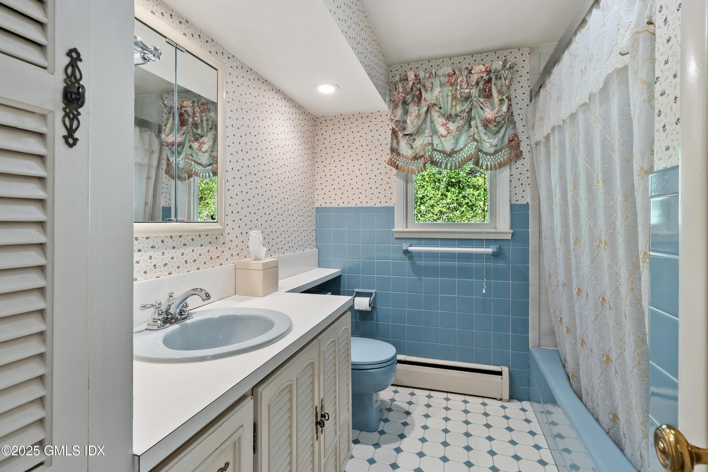 17 Cornwall Road Norwalk, CT 06850 - Photo 25 of 28 a bathroom with a sink a toilet a window and shower