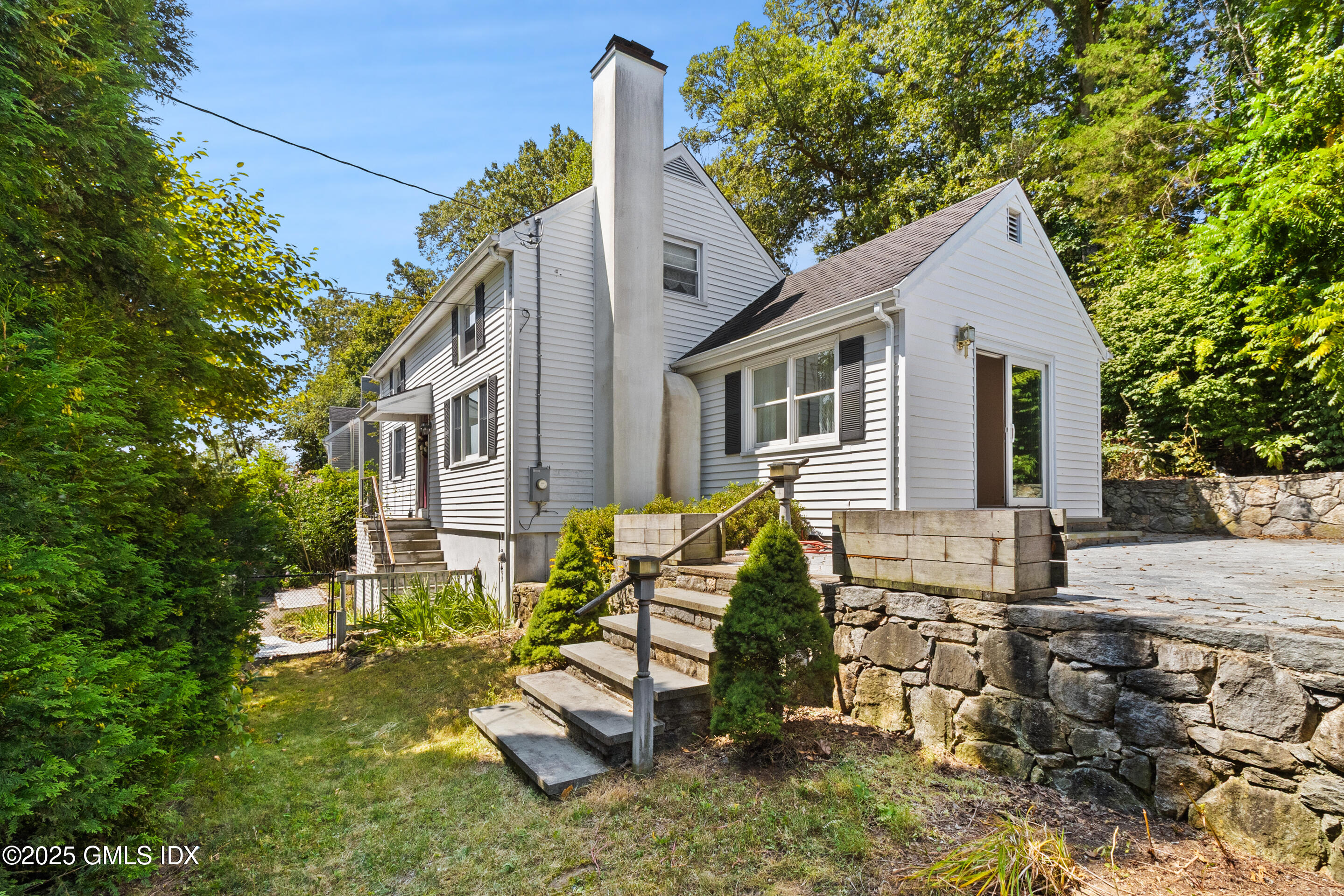 17 Cornwall Road Norwalk, CT 06850 - Photo 3 of 28 a view of a house with backyard and sitting area