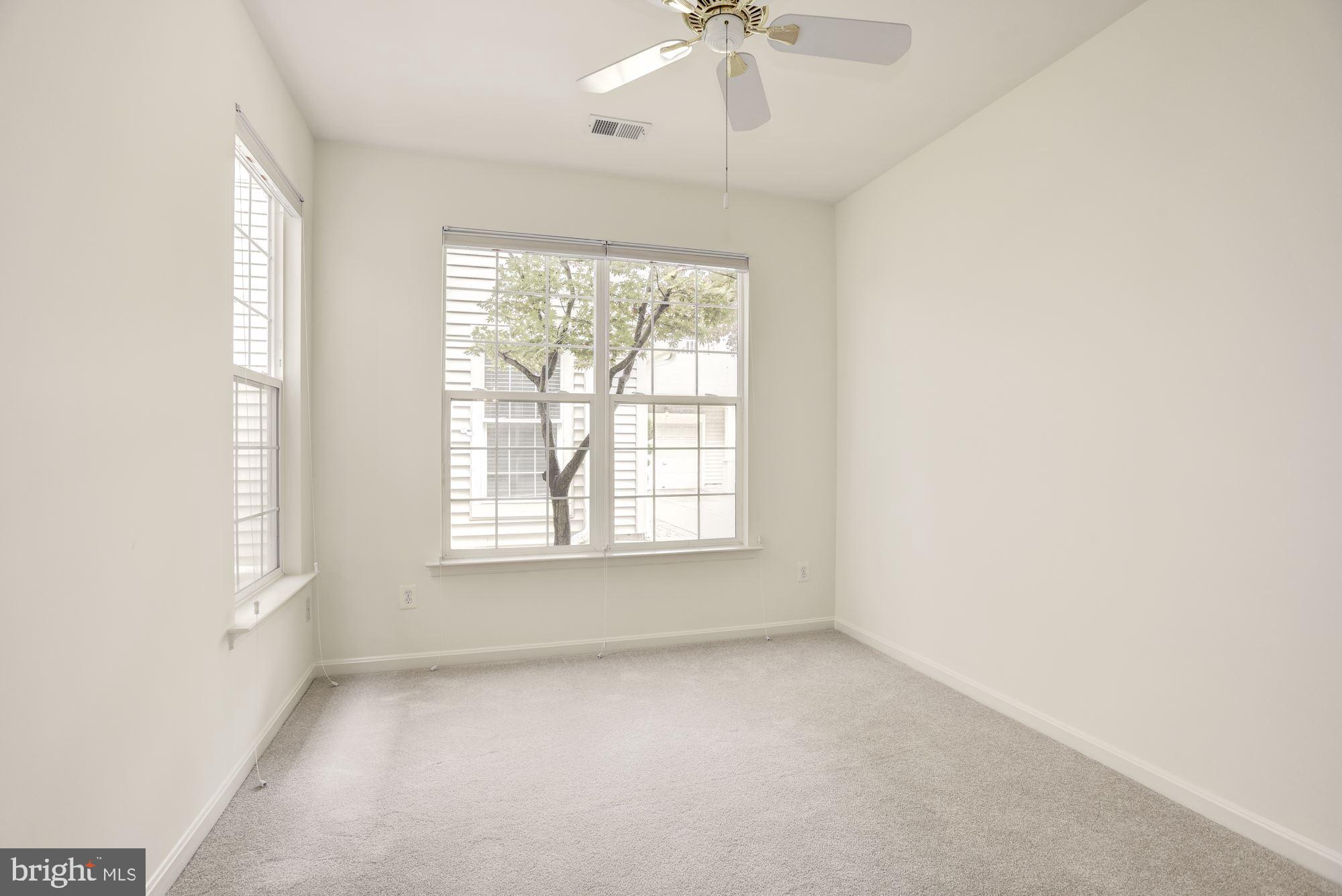 1307 Windleaf Drive, Unit 133 Reston, VA 20194 - Photo 16 of 26 Light Filled 2nd Bedroom w/ New Carpet
