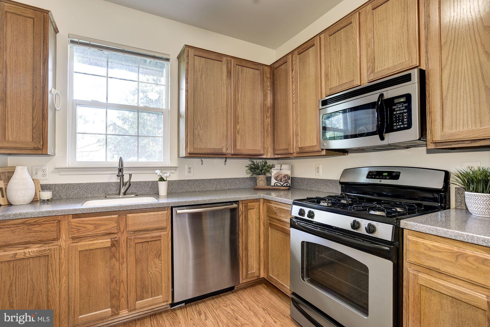 1307 Windleaf Drive, Unit 133 Reston, VA 20194 - Photo 8 of 26 Kitchen w/ Stainless Steel Appliances