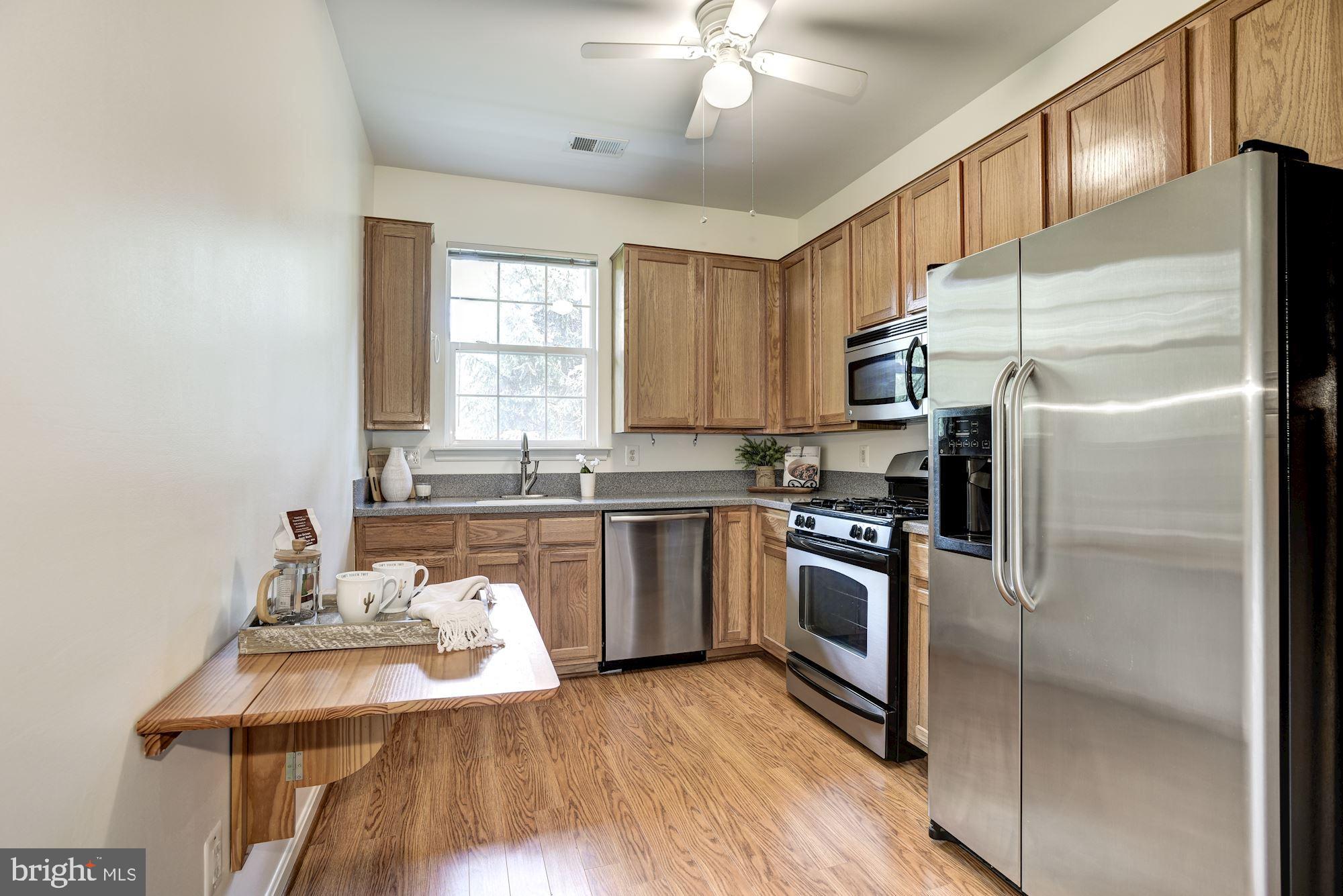 1307 Windleaf Drive, Unit 133 Reston, VA 20194 - Photo 9 of 26 Fold Down Table to Enjoy Morning Coffee