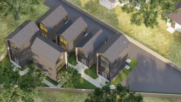 an aerial view of a house with outdoor space