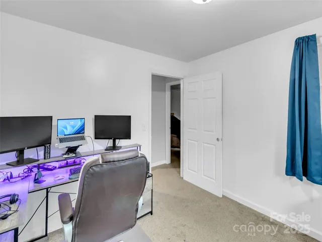 a bedroom with furniture and a chandelier