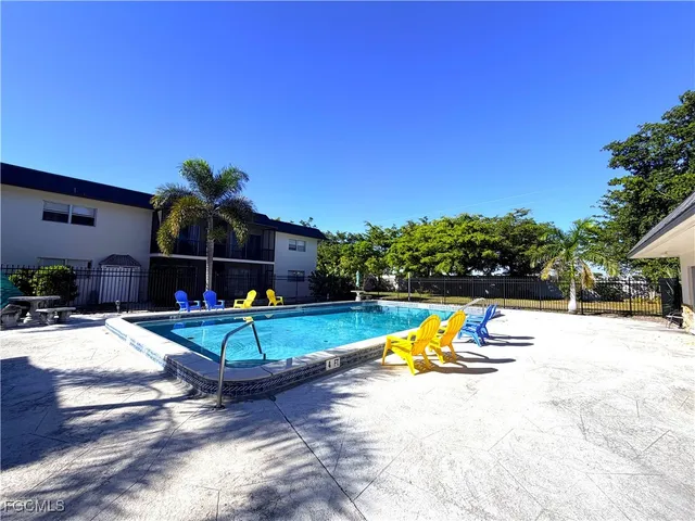 a view of pool with a small yard