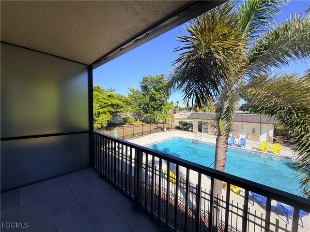 a view of balcony and yard