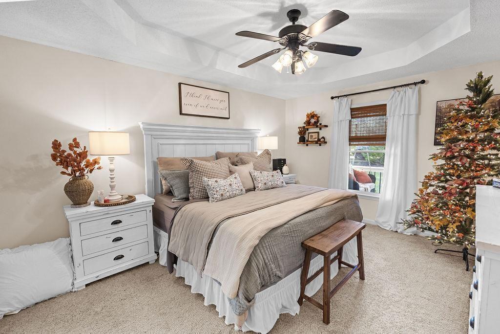 603 Cutoff Road Jasper, GA 30143 - Photo 13 of 24 a bedroom with a bed and a chandelier