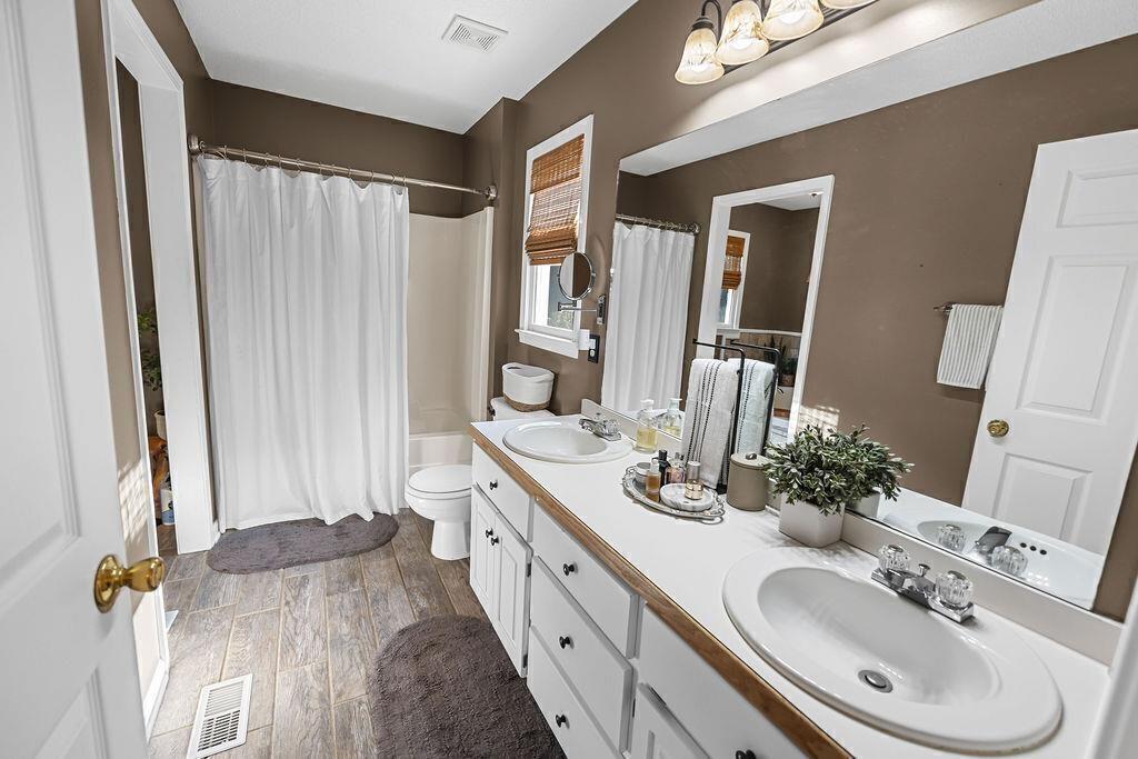 603 Cutoff Road Jasper, GA 30143 - Photo 15 of 24 a bathroom with a double vanity sink and mirror