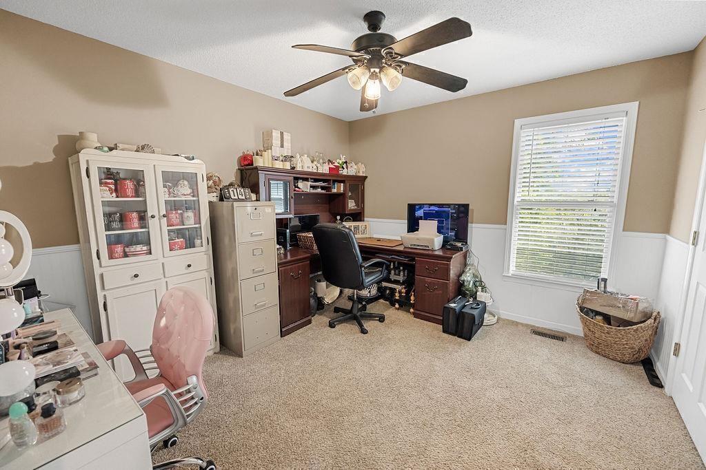 603 Cutoff Road Jasper, GA 30143 - Photo 18 of 24 a room with furniture a window and gym equipment