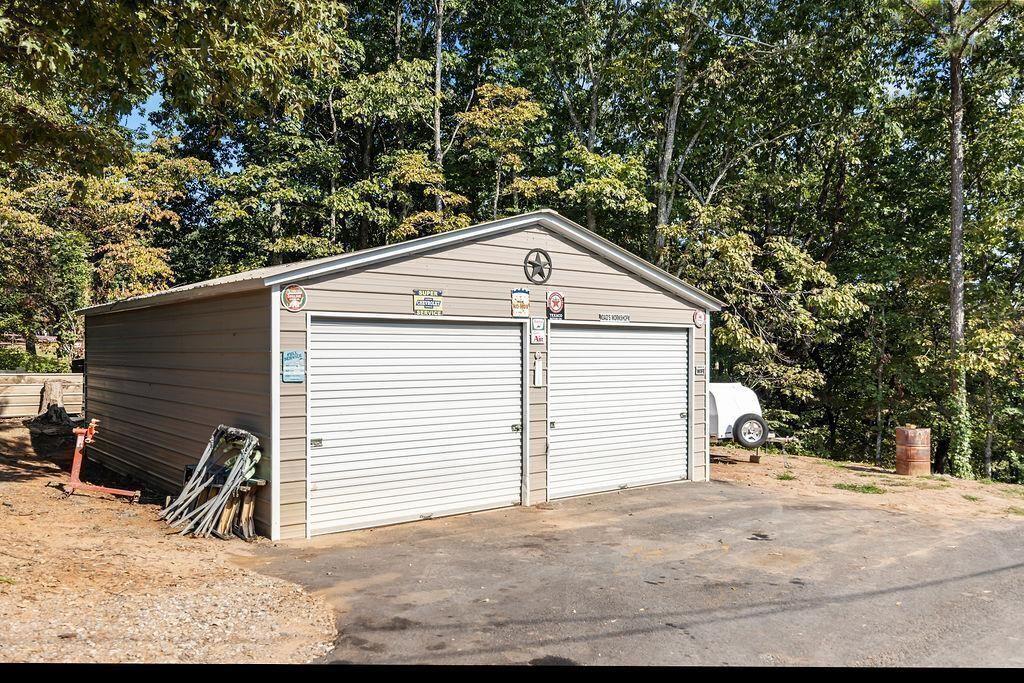 603 Cutoff Road Jasper, GA 30143 - Photo 22 of 24 a view of a house with a yard